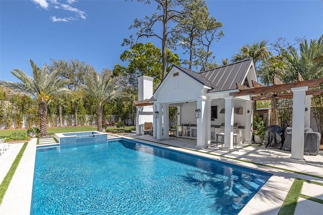 view of swimming pool with exterior bar, a patio, and an in ground hot tub