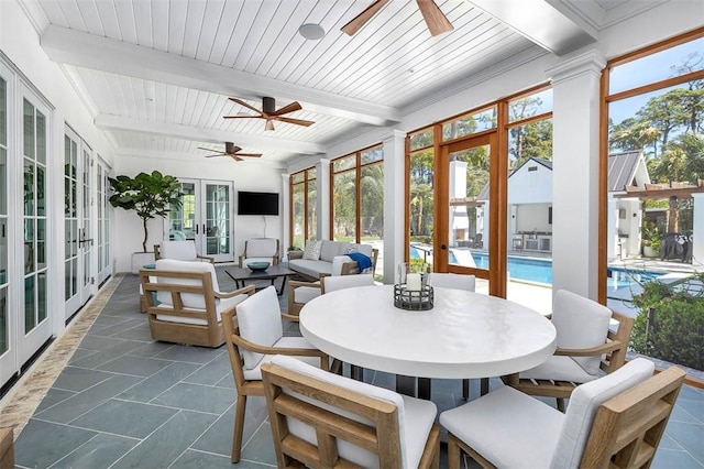 sunroom / solarium with french doors, a wealth of natural light, and beam ceiling