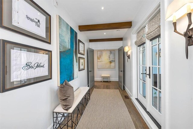 corridor with beam ceiling, french doors, and dark wood-type flooring