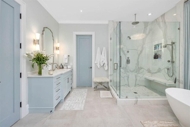 bathroom featuring tile patterned floors, vanity, ornamental molding, and independent shower and bath