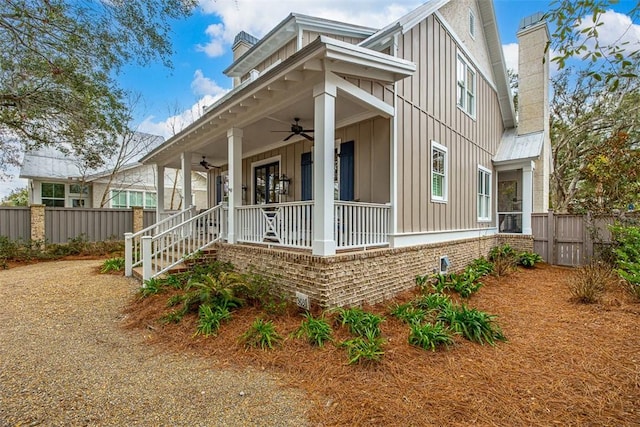 view of home's exterior featuring ceiling fan and a porch