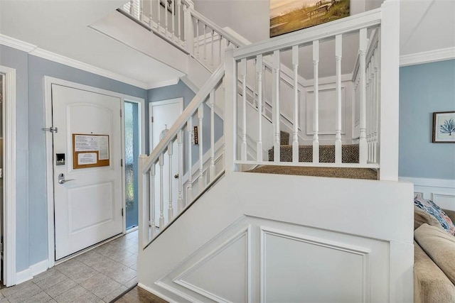 1175 N Beachview Dr Unit 279, Jekyll Island, GA 31527 - entrance foyer featuring stairway and ornamental molding