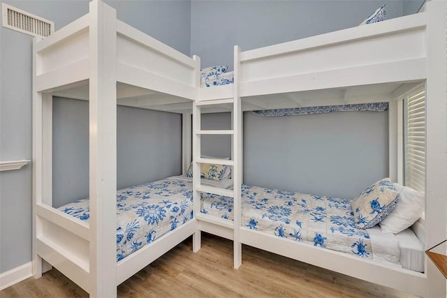 1175 N Beachview Dr Unit 279, Jekyll Island, GA 31527 - bedroom featuring wood finished floors and baseboards