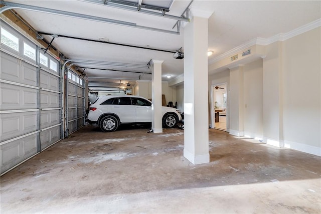 1151 W Mission Ln SE, Darien, GA 31305 - garage featuring a garage door opener and baseboards
