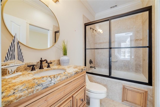 1151 W Mission Ln SE, Darien, GA 31305 - full bath featuring toilet, vanity, shower / bath combination with glass door, and ornamental molding