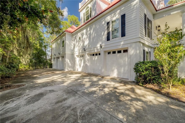 1151 W Mission Ln SE, Darien, GA 31305 - view of property exterior with a garage and concrete driveway