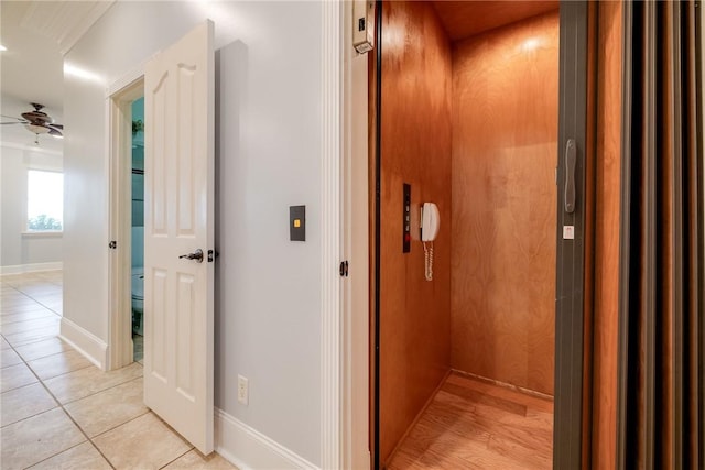 1151 W Mission Ln SE, Darien, GA 31305 - hall with elevator, light tile patterned floors, and baseboards