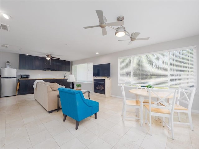 900 Mallory St, Saint Simons Island, GA 31522 - living area with a fireplace, a ceiling fan, baseboards, and recessed lighting