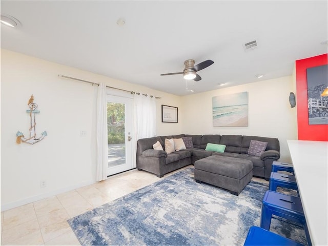 900 Mallory St, Saint Simons Island, GA 31522 - tiled living room featuring a ceiling fan and baseboards