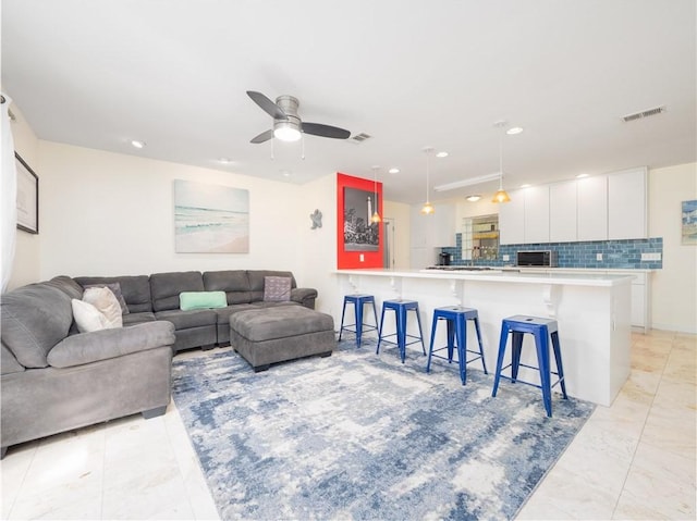 900 Mallory St, Saint Simons Island, GA 31522 - living area featuring a ceiling fan, recessed lighting, and light marble finish floors