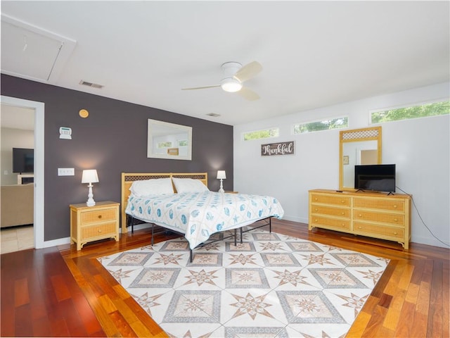 900 Mallory St, Saint Simons Island, GA 31522 - bedroom featuring attic access, multiple windows, and wood-type flooring