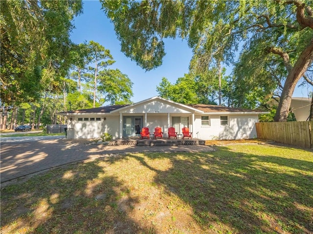 900 Mallory St, Saint Simons Island, GA 31522 - view of front facade featuring french doors and a garage