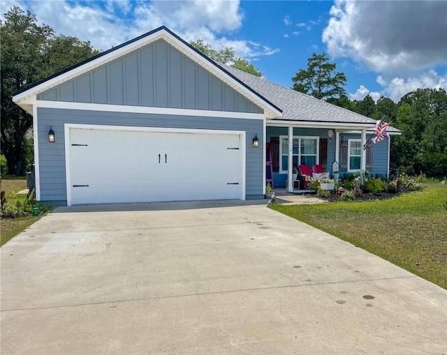 112 Eva Dr, Saint Marys, GA 31558 - ranch-style home featuring board and batten siding, a porch, a shingled roof, concrete driveway, and an attached garage