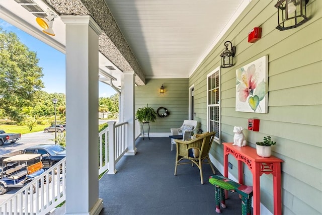 balcony featuring a porch