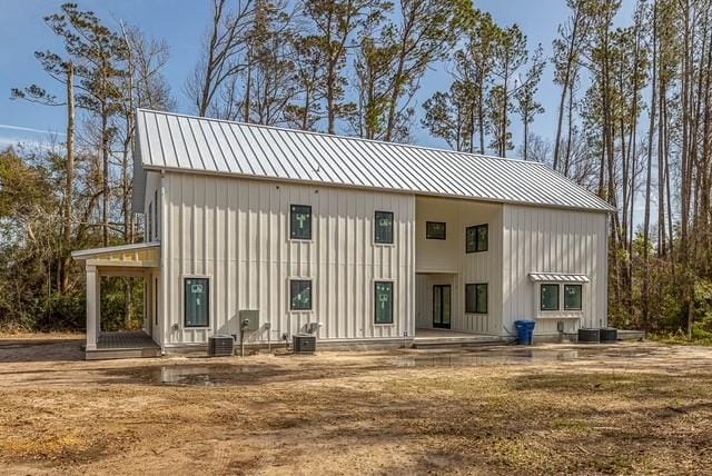 back of property featuring central AC unit