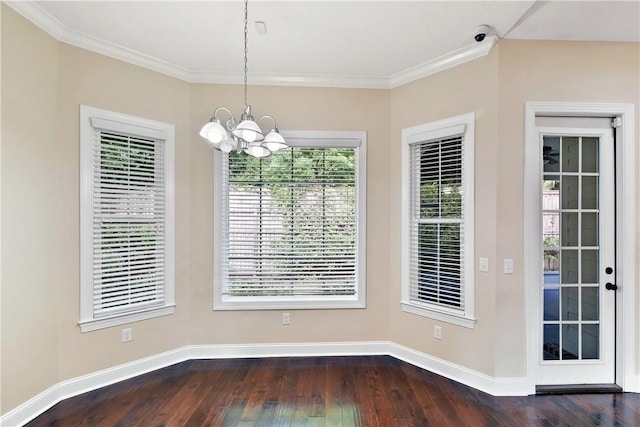 168 Township Bluff Cir, Saint Simons Island, GA 31522 - unfurnished dining area featuring dark hardwood / wood-style flooring, crown molding, and an inviting chandelier