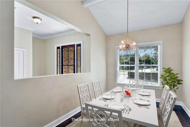 168 Township Bluff Cir, Saint Simons Island, GA 31522 - dining space with hardwood / wood-style flooring, a notable chandelier, lofted ceiling, and crown molding