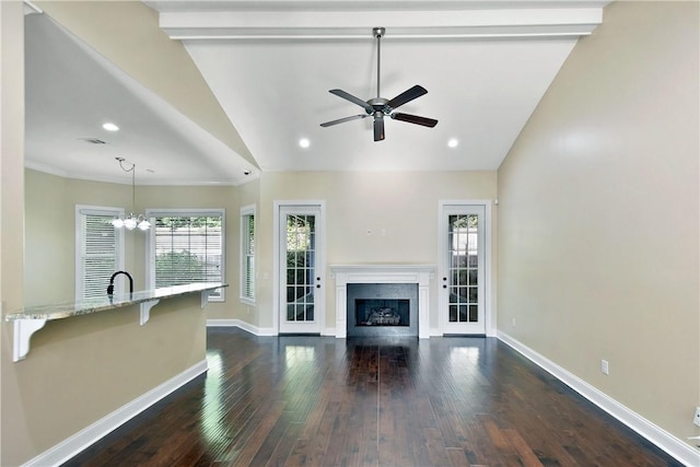 168 Township Bluff Cir, Saint Simons Island, GA 31522 - unfurnished living room featuring ceiling fan with notable chandelier, beam ceiling, sink, and dark wood-type flooring