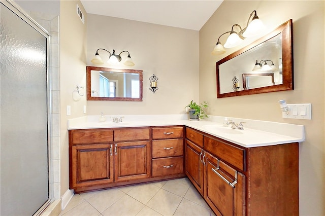 bathroom featuring tile patterned flooring, vanity, and an enclosed shower