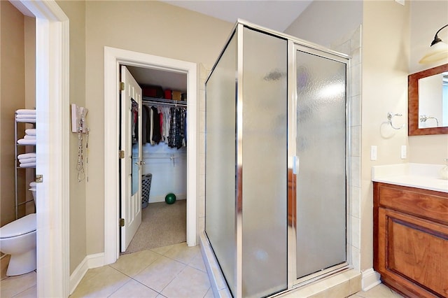 163 N Cottages Dr, Saint Simons Island, GA 31522 - full bathroom featuring vanity, a spacious closet, a shower stall, and tile patterned flooring