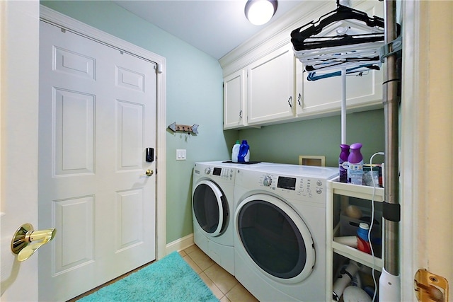 163 N Cottages Dr, Saint Simons Island, GA 31522 - laundry room featuring separate washer and dryer, cabinet space, and light tile patterned floors