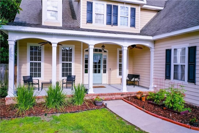 doorway to property with ceiling fan and covered porch