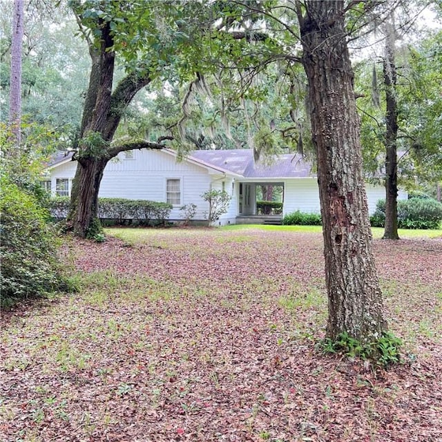 ranch-style house featuring a carport