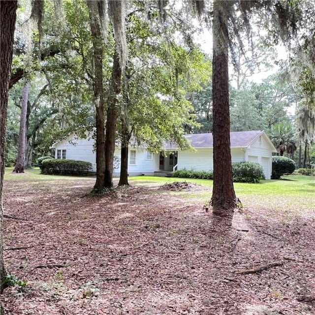 view of yard featuring an attached garage