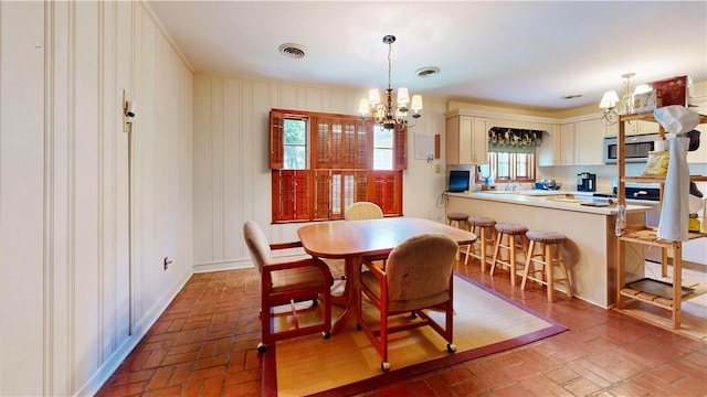 dining space featuring an inviting chandelier and a wealth of natural light