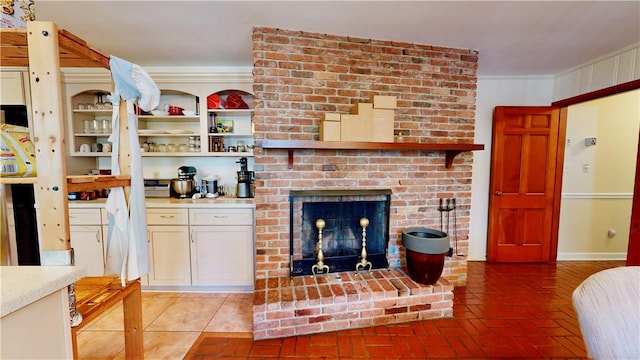 living room featuring ornamental molding and a fireplace