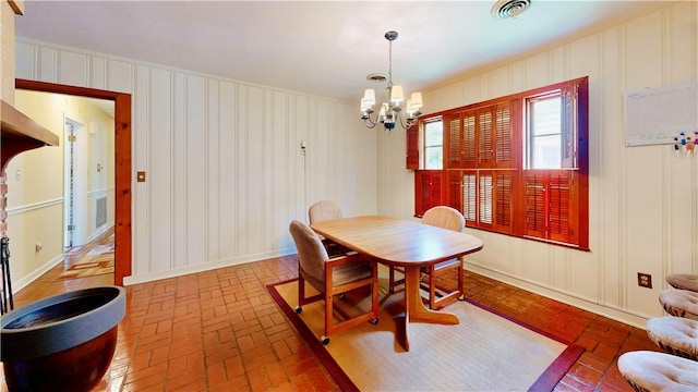 dining space featuring an inviting chandelier