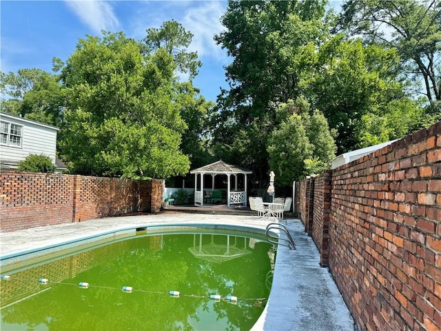 view of pool with a gazebo and a patio area