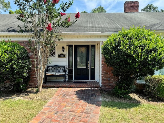 doorway to property featuring covered porch