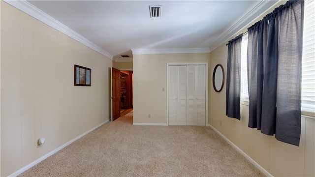 unfurnished room featuring light colored carpet and a wealth of natural light