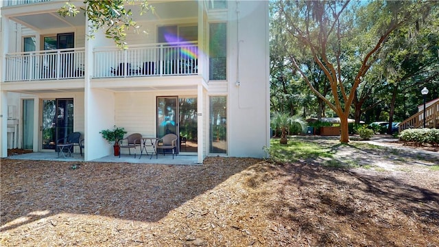 back of property featuring a patio