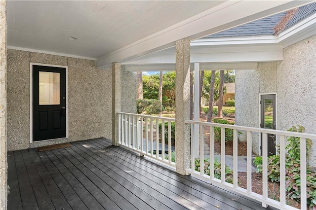 104 Augusta, Saint Simons Island, GA 31522 - wooden deck featuring covered porch