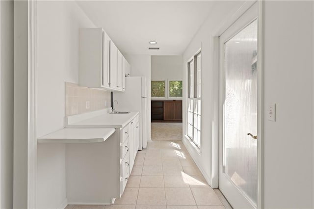 104 Augusta, Saint Simons Island, GA 31522 - corridor featuring a sink, light tile patterned floors, and visible vents