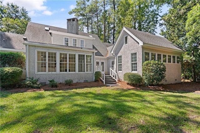 104 Augusta, Saint Simons Island, GA 31522 - rear view of property with roof with shingles, stucco siding, a chimney, crawl space, and a yard