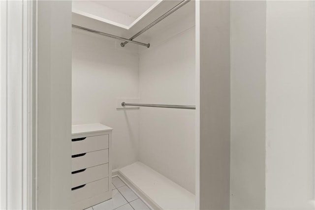 104 Augusta, Saint Simons Island, GA 31522 - walk in closet with light tile patterned flooring