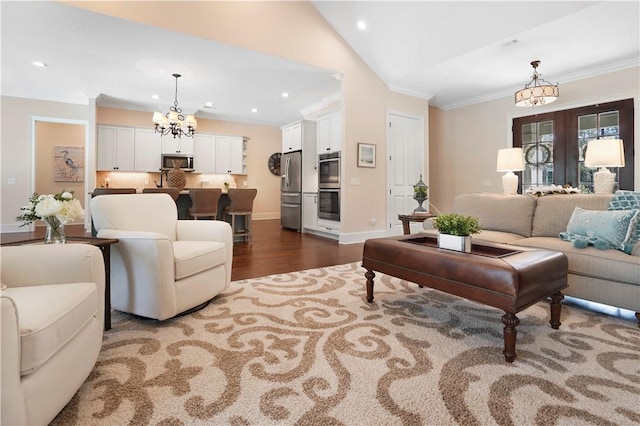 living area with lofted ceiling, dark wood-style floors, an inviting chandelier, crown molding, and recessed lighting