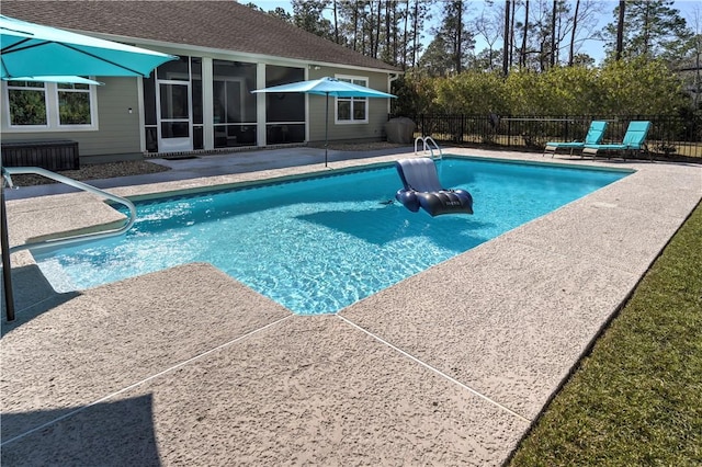 view of pool with a fenced in pool, a sunroom, a patio, and fence