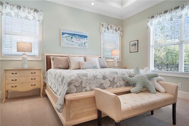 bedroom with light colored carpet, crown molding, and baseboards