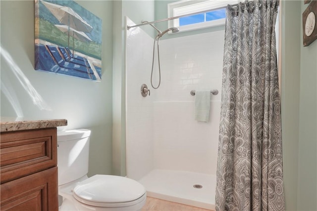 full bathroom with a shower stall and toilet