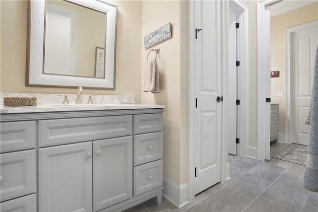 bathroom featuring vanity and baseboards