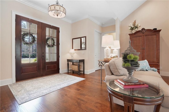 entryway with baseboards, french doors, dark wood finished floors, and crown molding