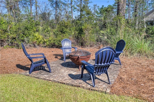 view of yard featuring a patio area and an outdoor fire pit