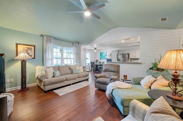 living room with visible vents, dark wood finished floors, baseboards, lofted ceiling, and ceiling fan