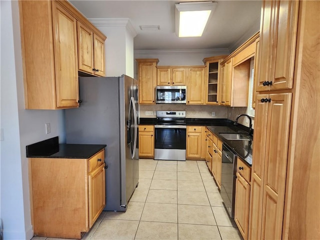 115 Simonton Way, Saint Simons Island, GA 31522 - kitchen with decorative backsplash, appliances with stainless steel finishes, crown molding, sink, and light tile patterned flooring