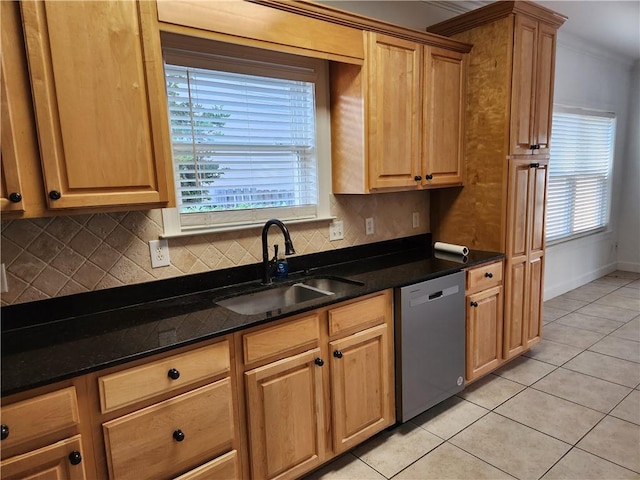 115 Simonton Way, Saint Simons Island, GA 31522 - kitchen featuring light tile patterned floors, stainless steel dishwasher, dark stone counters, and sink