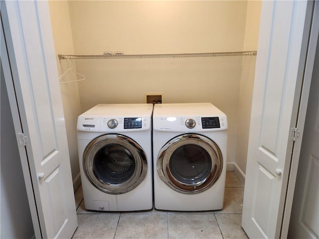 115 Simonton Way, Saint Simons Island, GA 31522 - clothes washing area with separate washer and dryer and light tile patterned floors